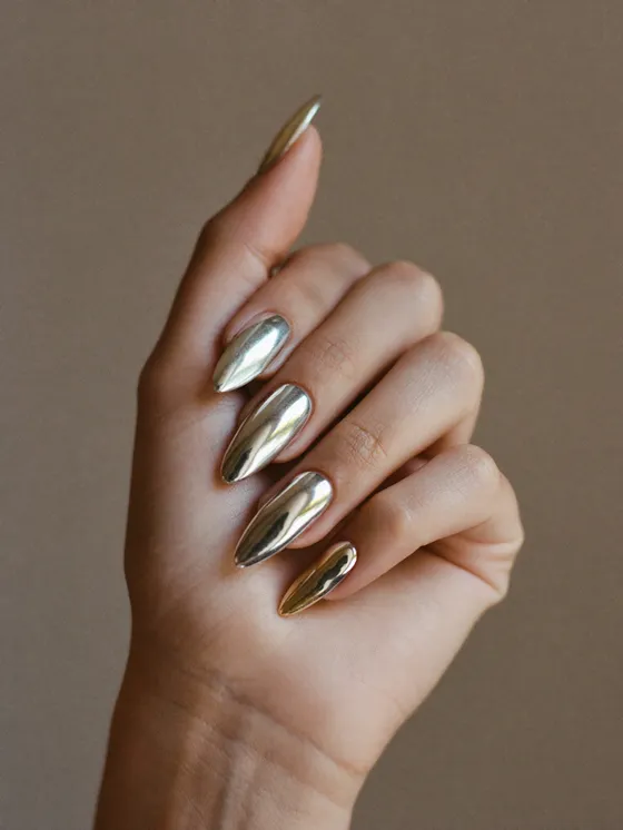 Short almond nails in a liquid chrome mirror finish