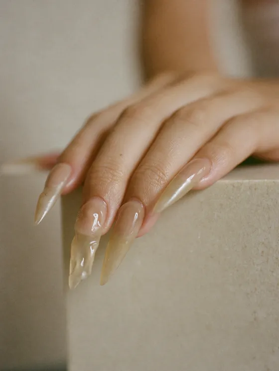 Freshly finished gel extensions in a translucent milky beige